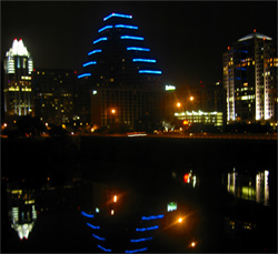 Austin nighttime skyline reflected in the river.