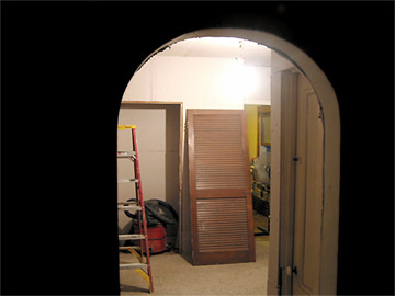 The dining room, with the kitchen beyond.