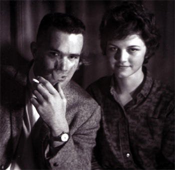 My parents, with dad trying to be all smooth with cigarette smoke coming out his mouth.